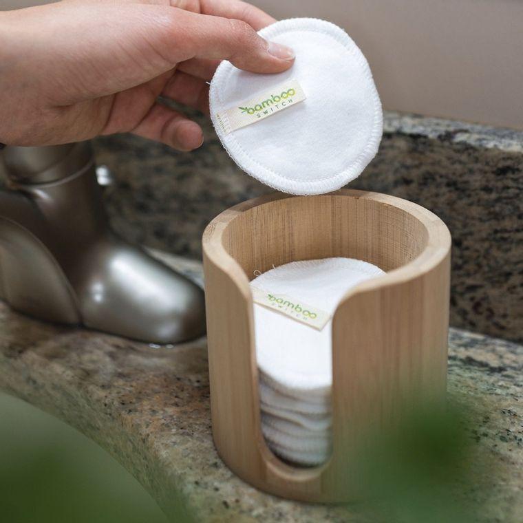 Facial rounds holder with rounds inside. Next to sink.