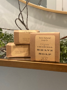 three kraft boxes with the label "Bare Natural Soap Co., Organic, charcoal shave soap" on label