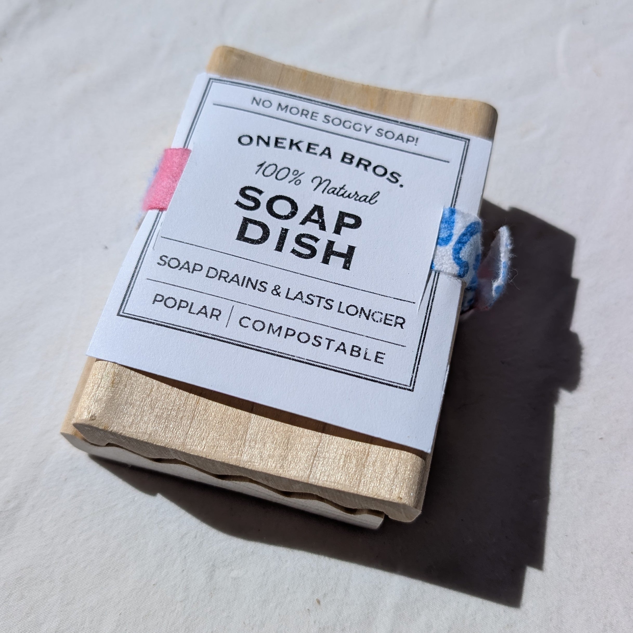 Onekea Bros. soap dish 2-pack with natural wood finish and label on a light background