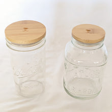 Load image into Gallery viewer, Bamboo lids on standard mouth and wide mouth mason jars, shown on a white background