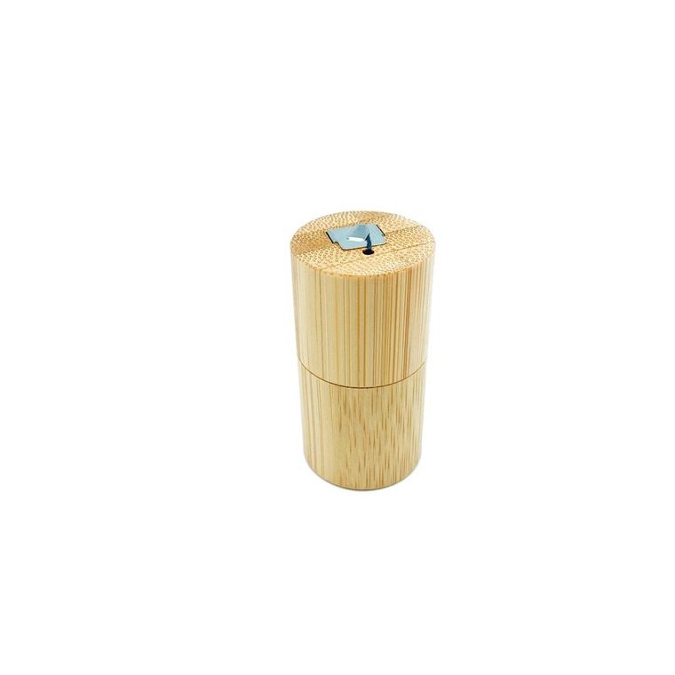 Tall, cylindrical, bamboo floss container. Pull to cut. White background.