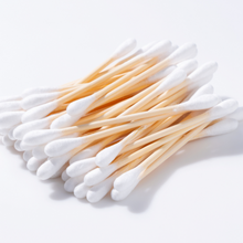 Load image into Gallery viewer, Handful of bamboo stick cotton swabs. 